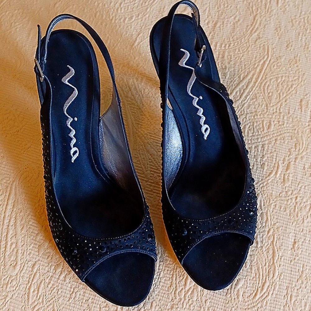 Black high heeled dress shoes.  They are sling type with glittery sets on them.